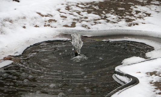frozen winter pond covered in snow