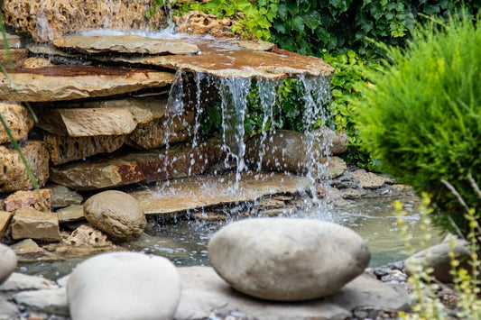 a pond waterfall made from rocks and slate